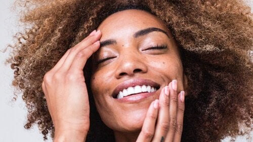 Close up of happy woman with beautiful clear skin