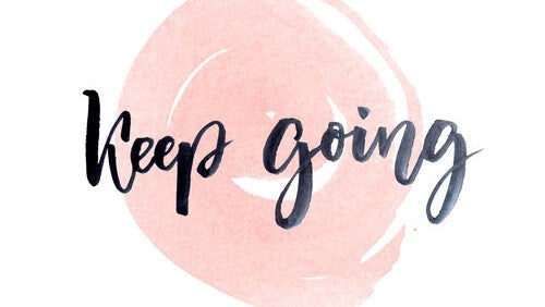 Text saying "keep going" on a pink circle